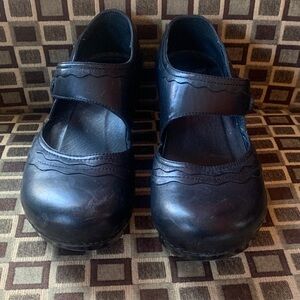 Dansko Black Strap Clog with designs.